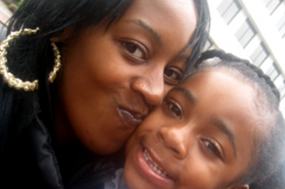 Juell F., a Boston member of Witnesses to Hunger, with her daughter